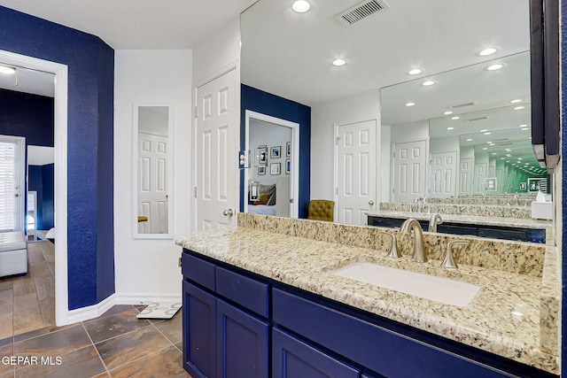 904 Las Palmas Way, El Paso, TX 79912 - bathroom with ensuite bath, baseboards, vanity, and recessed lighting