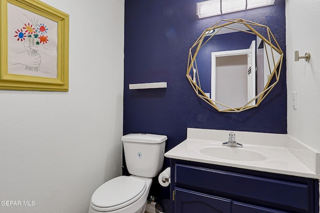 904 Las Palmas Way, El Paso, TX 79912 - bathroom featuring vanity, toilet, and a textured wall
