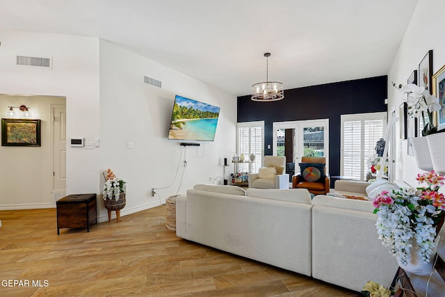 904 Las Palmas Way, El Paso, TX 79912 - living room with a chandelier, light wood-type flooring, healthy amount of natural light, and baseboards