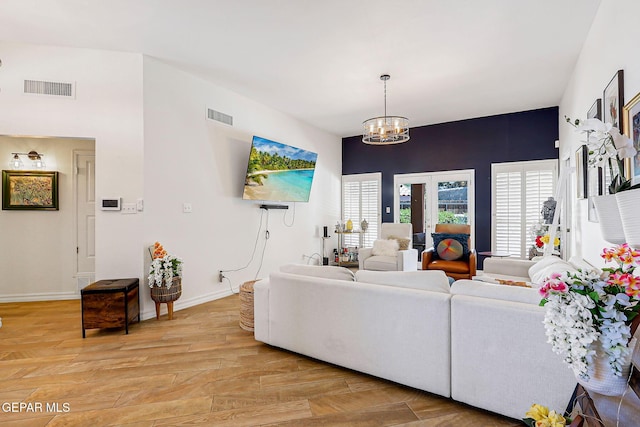 904 Las Palmas Way, El Paso, TX 79912 - living area with a chandelier, light wood finished floors, and baseboards