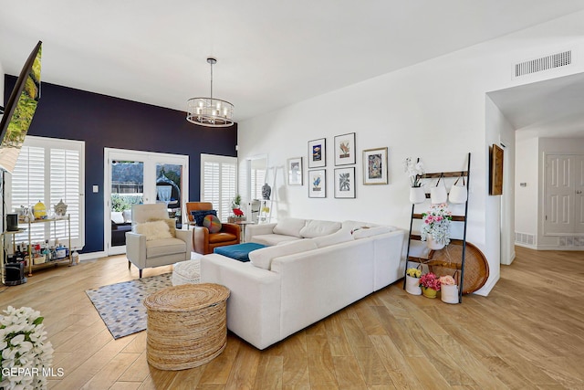 904 Las Palmas Way, El Paso, TX 79912 - living room with a chandelier, wood finished floors, and baseboards