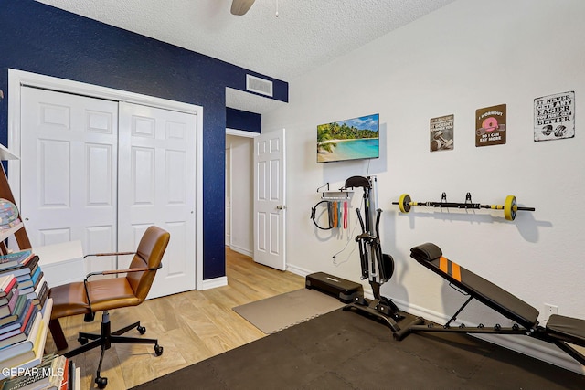 904 Las Palmas Way, El Paso, TX 79912 - exercise room featuring a textured ceiling, light wood finished floors, ceiling fan, and baseboards