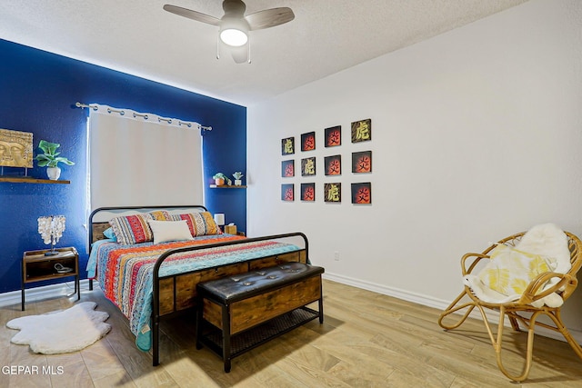 904 Las Palmas Way, El Paso, TX 79912 - bedroom featuring wood finished floors, a ceiling fan, and baseboards
