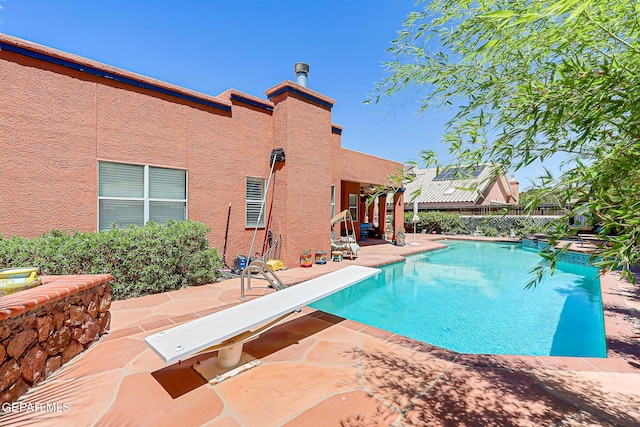 904 Las Palmas Way, El Paso, TX 79912 - view of pool featuring a patio, a diving board, and a pool with connected hot tub