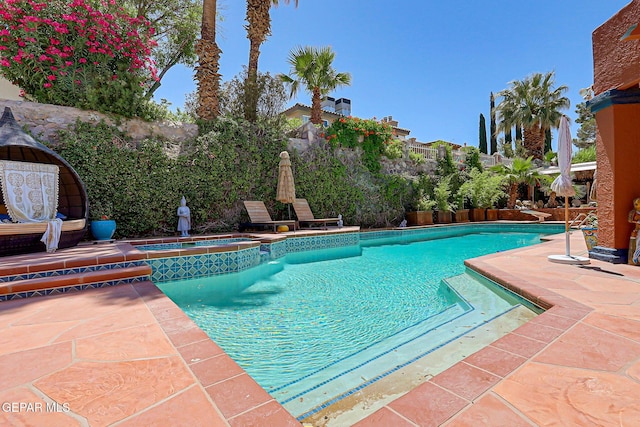 904 Las Palmas Way, El Paso, TX 79912 - view of pool with a patio area, a pool with connected hot tub, and a fenced backyard
