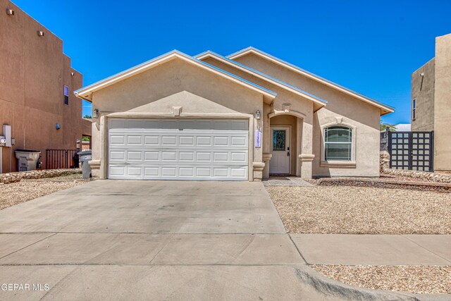 11361 Charles Reynolds Ln, El Paso, TX 79934 - view of front of home featuring stucco siding, a garage, and concrete driveway
