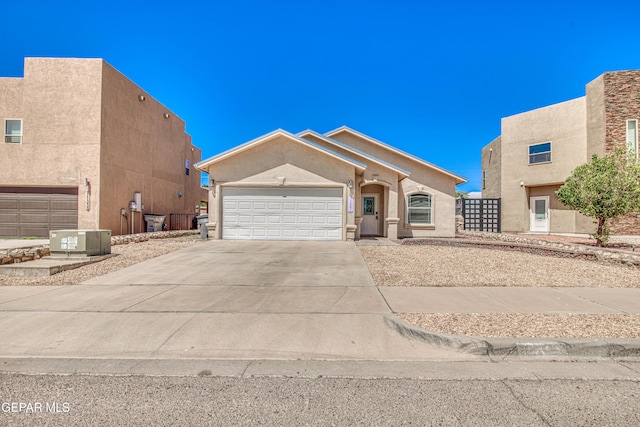 11361 Charles Reynolds Ln, El Paso, TX 79934 - view of front of home featuring driveway, an attached garage, and stucco siding
