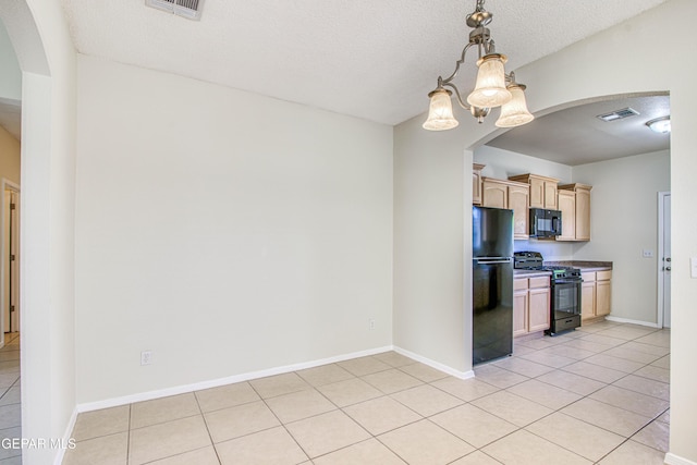 11361 Charles Reynolds Ln, El Paso, TX 79934 - kitchen with black appliances, arched walkways, light brown cabinets, and a chandelier