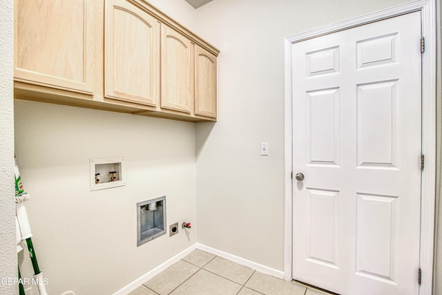 11361 Charles Reynolds Ln, El Paso, TX 79934 - laundry room with cabinet space, light tile patterned floors, electric dryer hookup, baseboards, and hookup for a washing machine