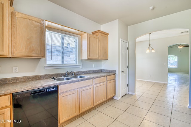 11361 Charles Reynolds Ln, El Paso, TX 79934 - kitchen with black dishwasher, light brown cabinets, a sink, arched walkways, and light tile patterned floors