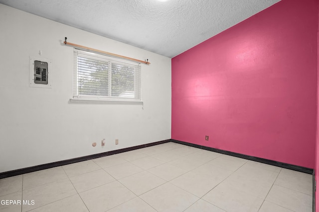 9913 Bomarc St, El Paso, TX 79924 - spare room with a textured ceiling, electric panel, and baseboards
