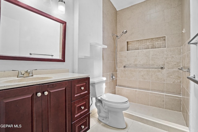 9913 Bomarc St, El Paso, TX 79924 - bathroom featuring tiled shower, toilet, vanity, and tile patterned flooring
