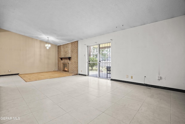 9913 Bomarc St, El Paso, TX 79924 - unfurnished living room with a chandelier, a textured ceiling, a fireplace, and tile patterned floors