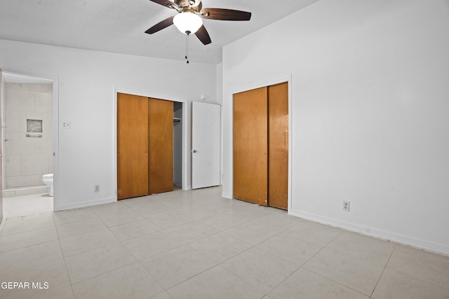 9913 Bomarc St, El Paso, TX 79924 - unfurnished bedroom featuring ensuite bath, light tile patterned floors, baseboards, and a ceiling fan
