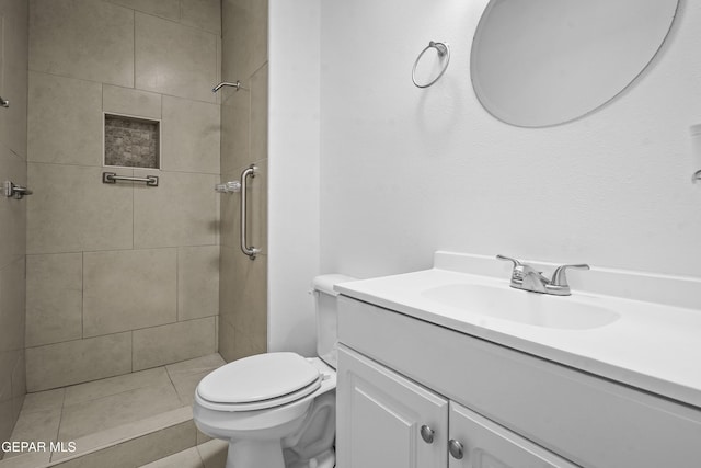 9913 Bomarc St, El Paso, TX 79924 - full bathroom featuring vanity, toilet, and a tile shower