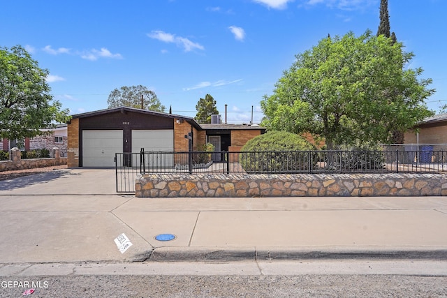 9913 Bomarc St, El Paso, TX 79924 - view of front of home with concrete driveway, brick siding, and a garage