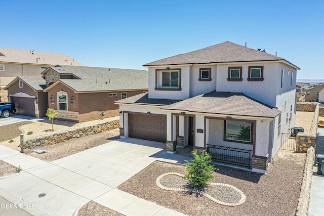 12772 Silver Streak Ave, El Paso, TX 79928 - view of front facade with covered porch, stucco siding, concrete driveway, and roof with shingles