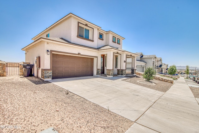 12772 Silver Streak Ave, El Paso, TX 79928 - view of front of house featuring stucco siding, stone siding, a gate, and driveway
