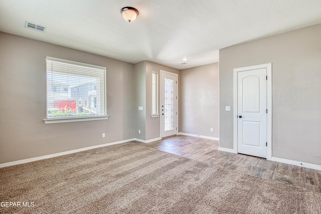 12772 Silver Streak Ave, El Paso, TX 79928 - entrance foyer featuring healthy amount of natural light, wood finished floors, and baseboards
