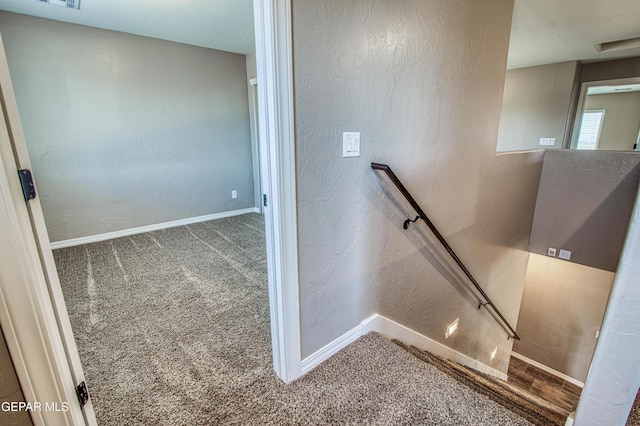 12772 Silver Streak Ave, El Paso, TX 79928 - stairway with carpet floors, baseboards, and a textured wall