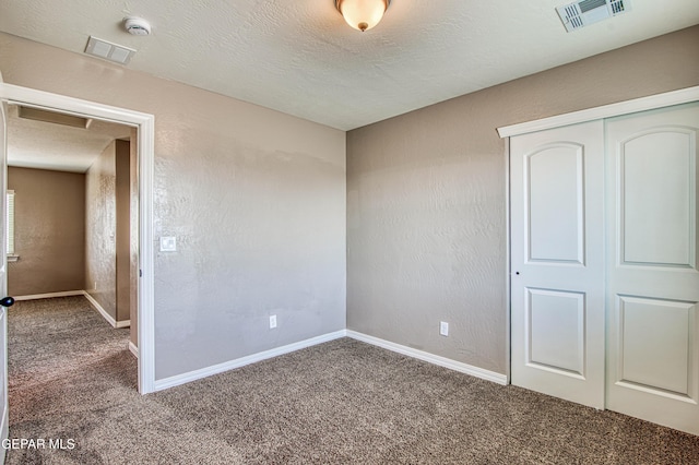 12772 Silver Streak Ave, El Paso, TX 79928 - carpeted spare room with a smoke detector, attic access, baseboards, and a textured ceiling