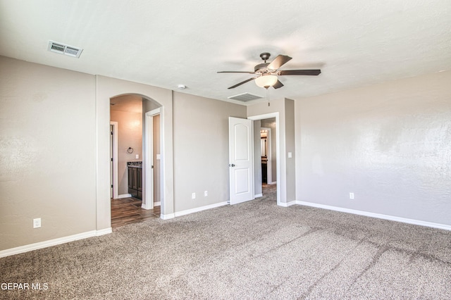 12772 Silver Streak Ave, El Paso, TX 79928 - unfurnished bedroom featuring arched walkways, carpet flooring, baseboards, and ceiling fan