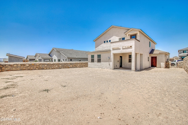 12772 Silver Streak Ave, El Paso, TX 79928 - rear view of house with a fenced backyard, stucco siding, and a patio