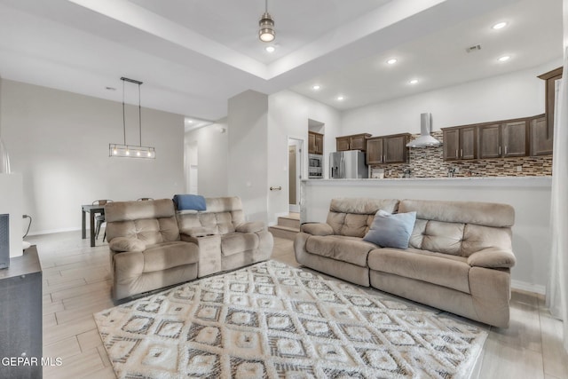 2367 Enchanted Peaks Ln, El Paso, TX 79911 - living area with recessed lighting, wood finished floors, and baseboards
