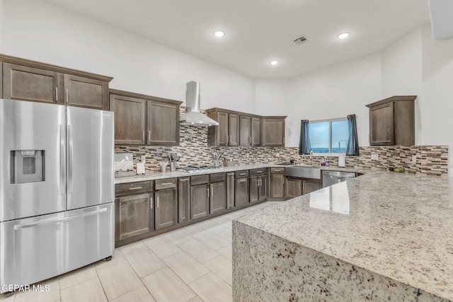 2367 Enchanted Peaks Ln, El Paso, TX 79911 - kitchen featuring appliances with stainless steel finishes, island range hood, a sink, decorative backsplash, and recessed lighting