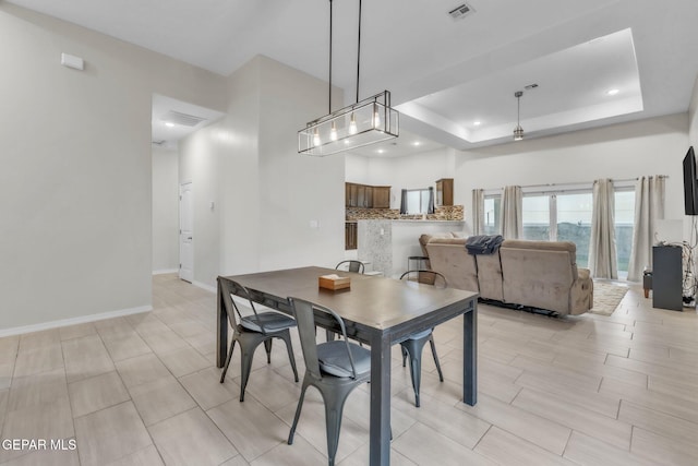 2367 Enchanted Peaks Ln, El Paso, TX 79911 - dining space with baseboards, a raised ceiling, and recessed lighting