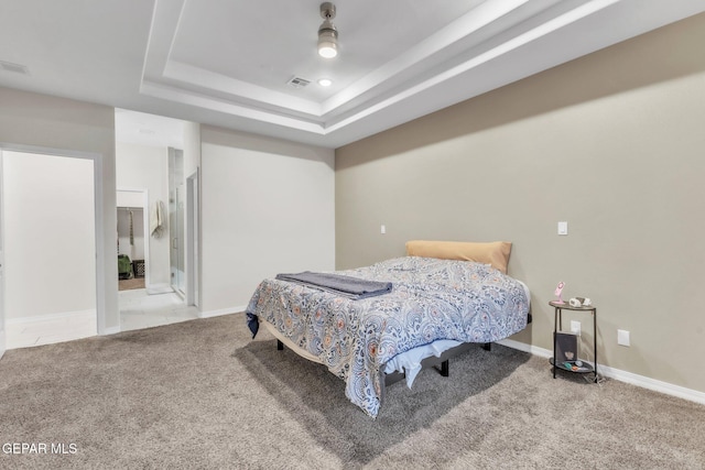 2367 Enchanted Peaks Ln, El Paso, TX 79911 - bedroom featuring carpet floors, a tray ceiling, and baseboards