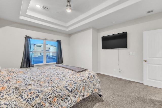 2367 Enchanted Peaks Ln, El Paso, TX 79911 - carpeted bedroom featuring a raised ceiling, a ceiling fan, and baseboards
