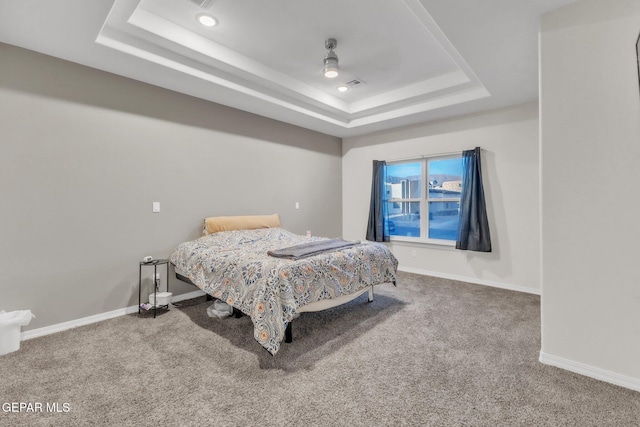 2367 Enchanted Peaks Ln, El Paso, TX 79911 - carpeted bedroom featuring a raised ceiling, baseboards, and a ceiling fan