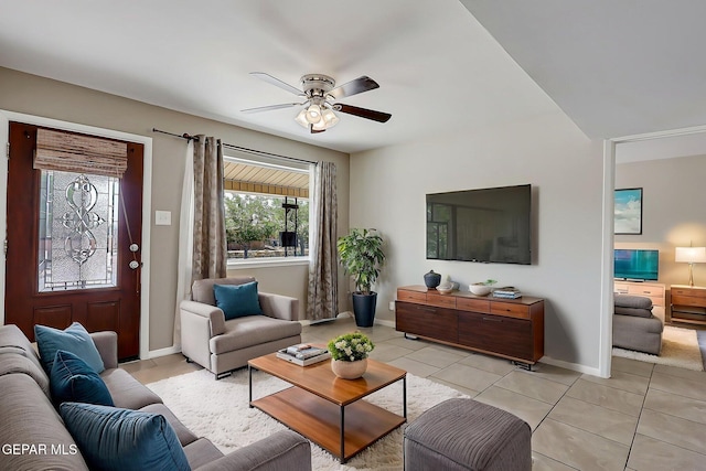 10321 Thor St, El Paso, TX 79924 - living area featuring light tile patterned flooring, a ceiling fan, and baseboards