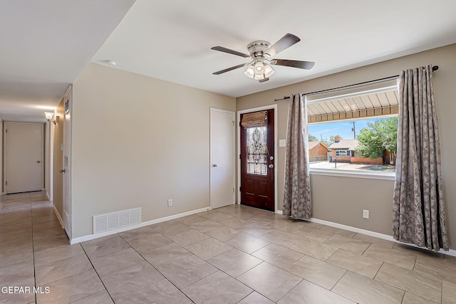 10321 Thor St, El Paso, TX 79924 - foyer entrance featuring baseboards, light tile patterned flooring, and ceiling fan