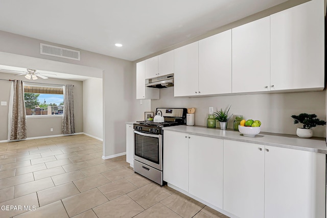 10321 Thor St, El Paso, TX 79924 - kitchen featuring stainless steel gas range, under cabinet range hood, light countertops, baseboards, and recessed lighting