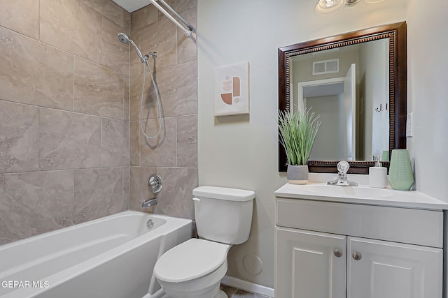 10321 Thor St, El Paso, TX 79924 - full bathroom with vanity, toilet, bathing tub / shower combination, and baseboards