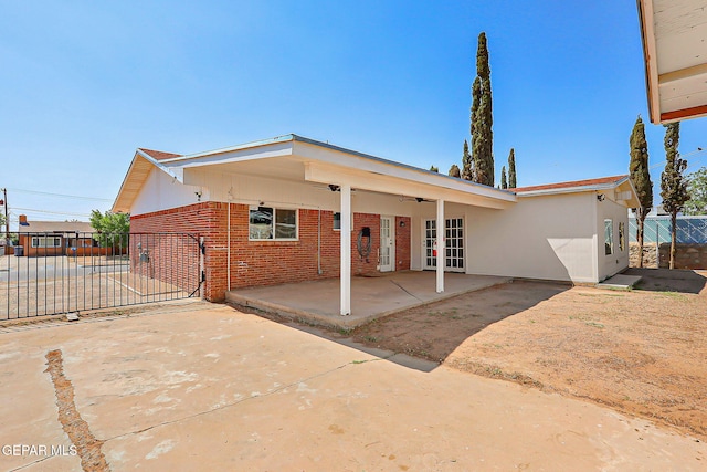 10321 Thor St, El Paso, TX 79924 - view of front of property featuring french doors, brick siding, a patio area, and ceiling fan