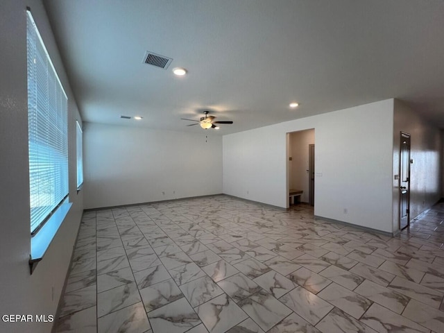 12868 Star Gaze Ave, El Paso, TX 79928 - unfurnished room with a ceiling fan, light marble finish floors, recessed lighting, and baseboards