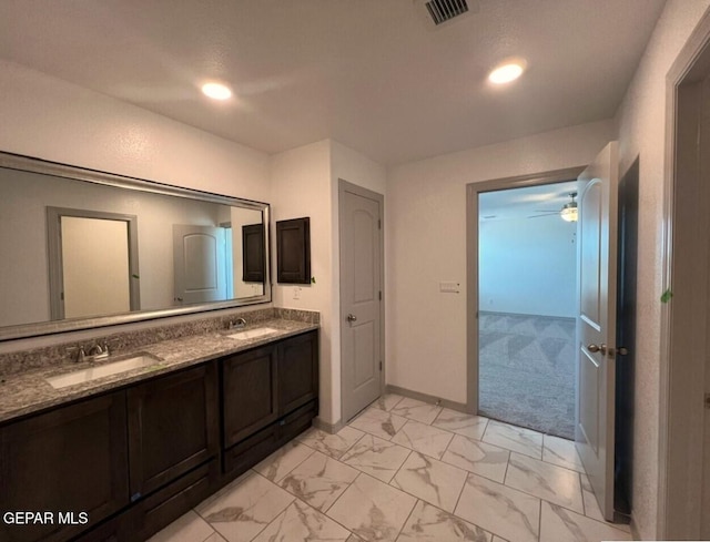 12868 Star Gaze Ave, El Paso, TX 79928 - bathroom featuring marble finish flooring, double vanity, recessed lighting, baseboards, and a ceiling fan