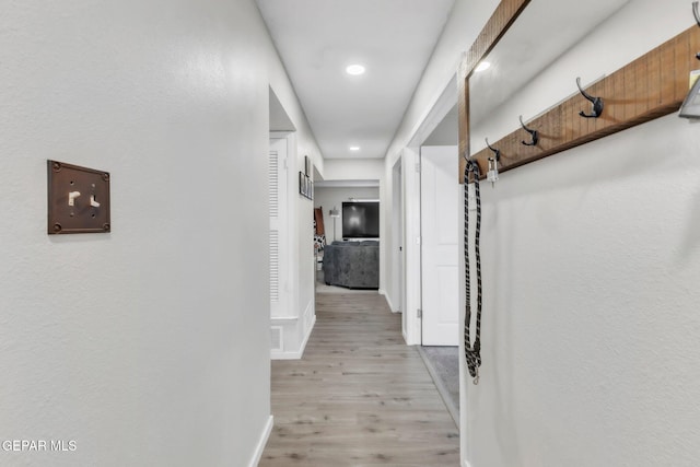 5717 Port Lavaca Dr, El Paso, TX 79924 - hallway with light wood-type flooring, baseboards, and recessed lighting