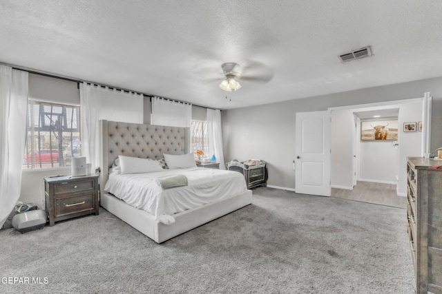 5717 Port Lavaca Dr, El Paso, TX 79924 - carpeted bedroom featuring a textured ceiling, a ceiling fan, and baseboards