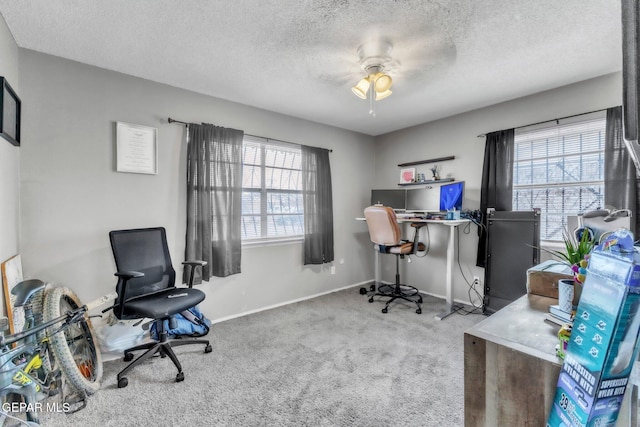 5717 Port Lavaca Dr, El Paso, TX 79924 - office area with carpet flooring, a textured ceiling, a ceiling fan, and baseboards
