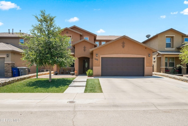14382 Karen Point Ct, El Paso, TX 79938 - view of front of property featuring an attached garage, stucco siding, and driveway