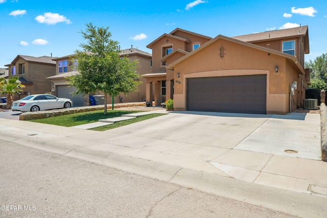 14382 Karen Point Ct, El Paso, TX 79938 - view of front of home with stucco siding, an attached garage, and concrete driveway