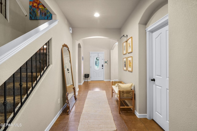 14382 Karen Point Ct, El Paso, TX 79938 - entryway featuring tile patterned flooring, arched walkways, stairway, recessed lighting, and baseboards