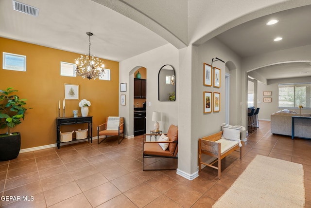 14382 Karen Point Ct, El Paso, TX 79938 - corridor featuring light tile patterned floors, arched walkways, recessed lighting, baseboards, and a chandelier