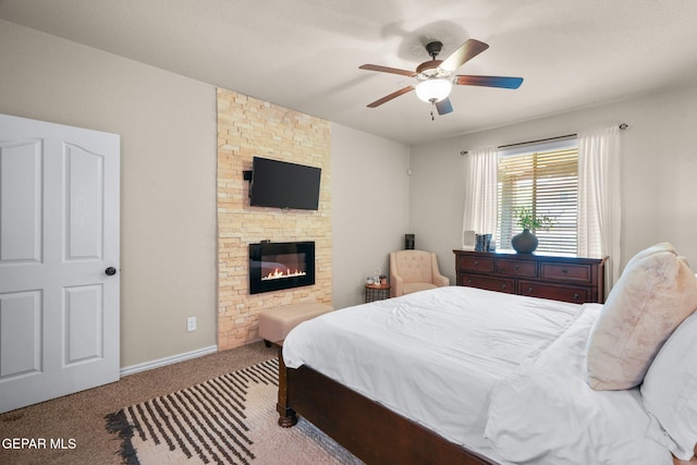 14382 Karen Point Ct, El Paso, TX 79938 - carpeted bedroom with a fireplace, a ceiling fan, and baseboards