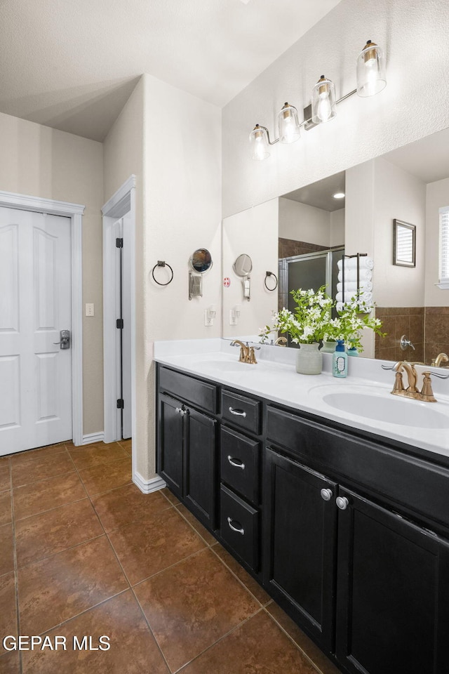 14382 Karen Point Ct, El Paso, TX 79938 - full bath featuring double vanity, tile patterned flooring, and a stall shower