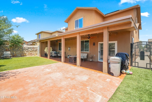14382 Karen Point Ct, El Paso, TX 79938 - back of property featuring a ceiling fan, stucco siding, and a patio